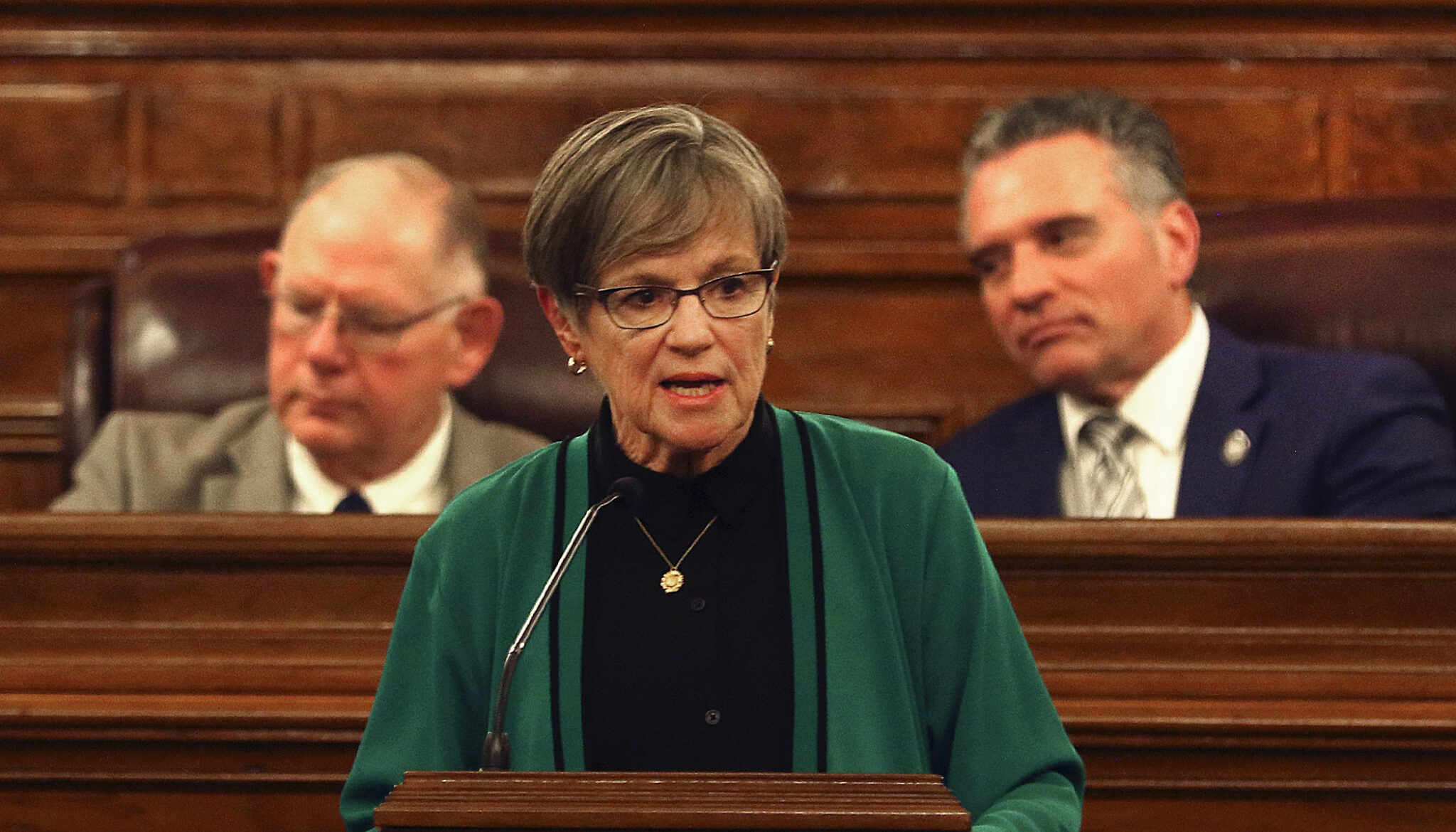 Gov. Laura Kelly delivers her State of the State address, with House Speaker Dan Hawkins and Senate President Ty Masterson behind her. File photo, Jan. 13, 2026.
